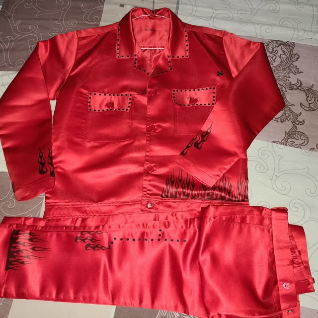 Red satin shirt and pants with black flames and studs